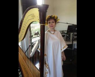 Catherine in front of her harp 