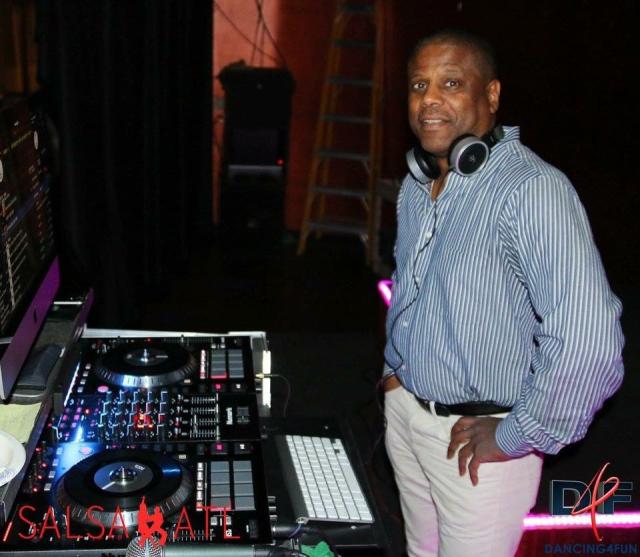 DJ-Tony Unique in front of a DJ board