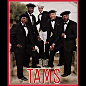 The Tams in black suits 