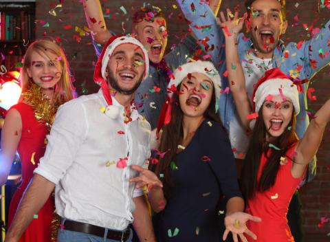 People in Christmas attire at a corporate party