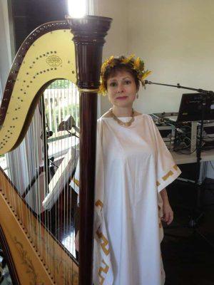 Catherine in front of her harp 