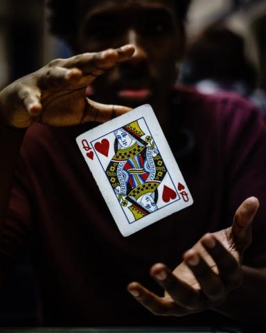 A magician with a car levitating between his hands