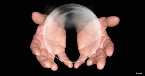 A magician holding a bubble 