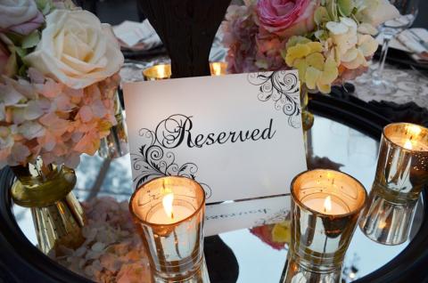 A sign on table that says reserved