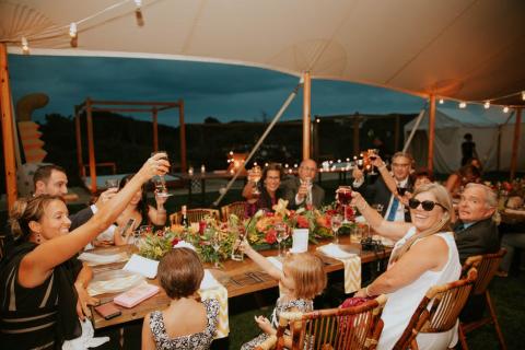 A table of people toasting