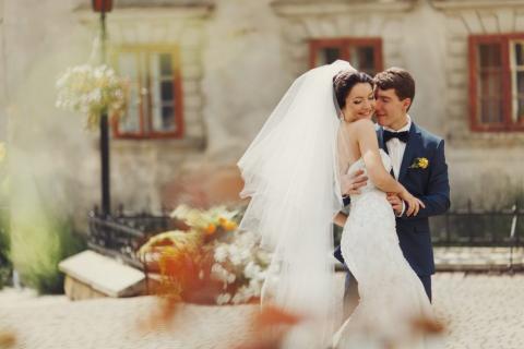 A bride and groom hugging