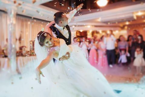 A bride and groom ballroom dancing
