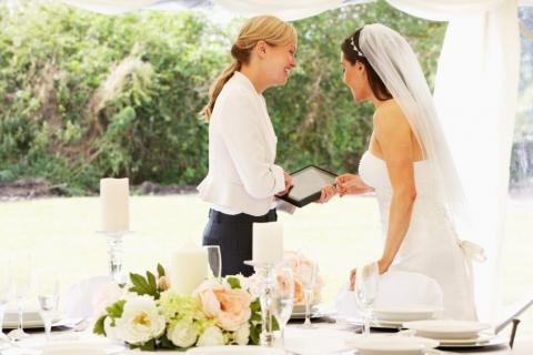 Wedding planner talking with bride