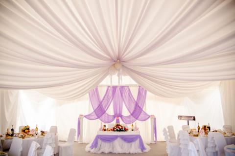 A wedding with a draping silk ceiling