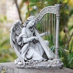 A stone angel playing the harp