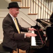 Jim Tiernan at a piano playing