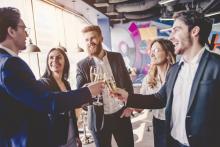 People toasting at a corporate party