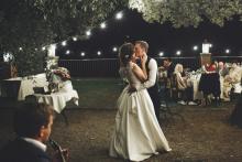 A couple kissing at their wedding ceremony 